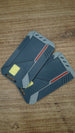 Two WARDOGS Alpha Card 1 keycard replicas stacked together, showing the futuristic grey panels, yellow chip features and red accent details.