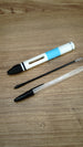 WARDOGS Adrenaline Stim Pen casing displayed with a black ballpoint refill and a transparent BIC-style pen to illustrate the writing pen setup.